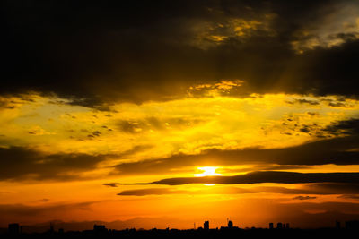 Low angle view of dramatic sky during sunset