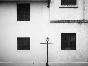 Close-up of street light against building