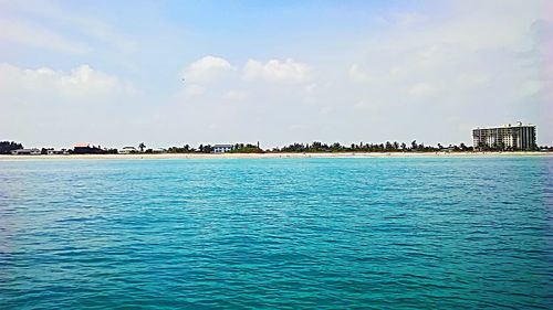 Scenic view of sea against blue sky