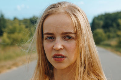 Close-up portrait of a smiling young woman
