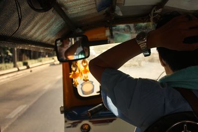 Woman holding car in bus