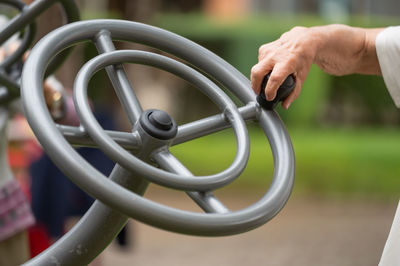 Cropped hand of man repairing car