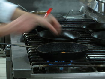 Close-up of man preparing food in kitchen