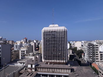 Modern buildings in city against sky