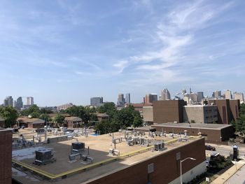 High angle view of buildings in city against sky