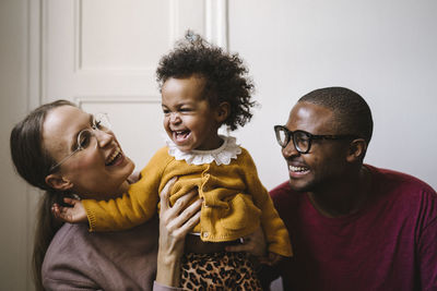 Smiling young family with daughter