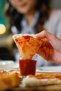 Close-up of hand holding food