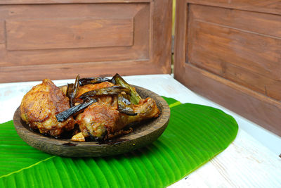 Ayam goreng kampung or traditional fried chicken from indonesia on the table.