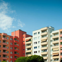Low angle view of buildings against blue sky