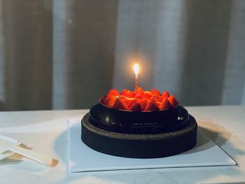 Burning candles on birthday cake