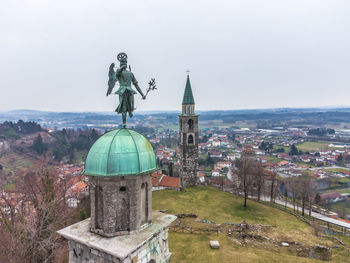 Panoramic shot of buildings in city against sky