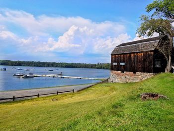 Scenic view of lake against cloudy sky