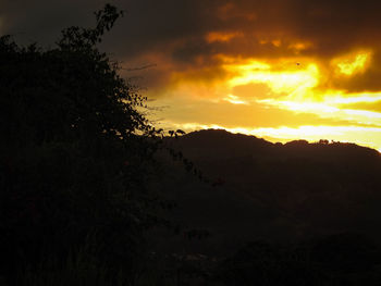 Scenic view of silhouette landscape against sky during sunset