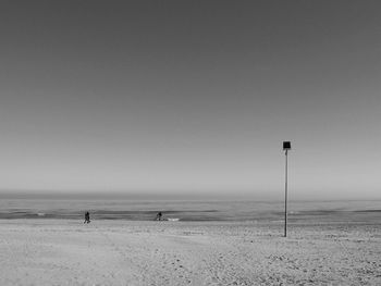 Scenic view of beach against clear sky