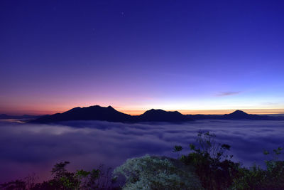 Scenic view of mountains against sky during sunset