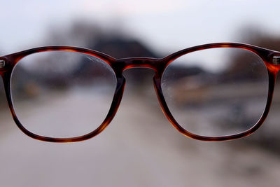 Close-up of eyeglasses outdoors