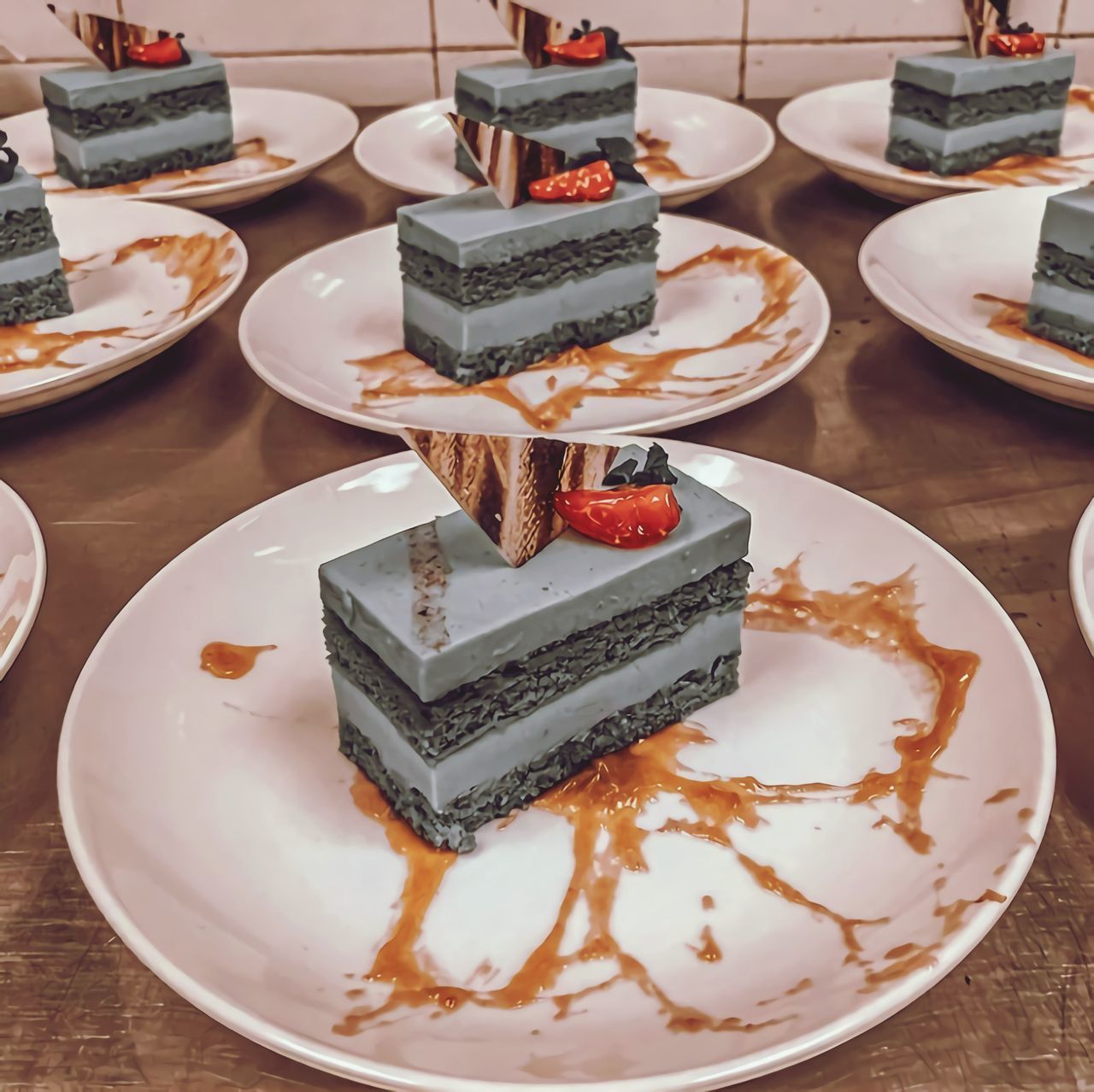 HIGH ANGLE VIEW OF CAKE SERVED ON TABLE