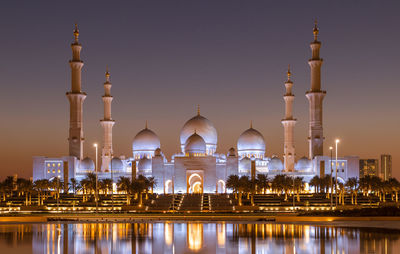 Illuminated cathedral against clear sky at night