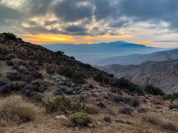 Scenic view of mountains against sky during sunset