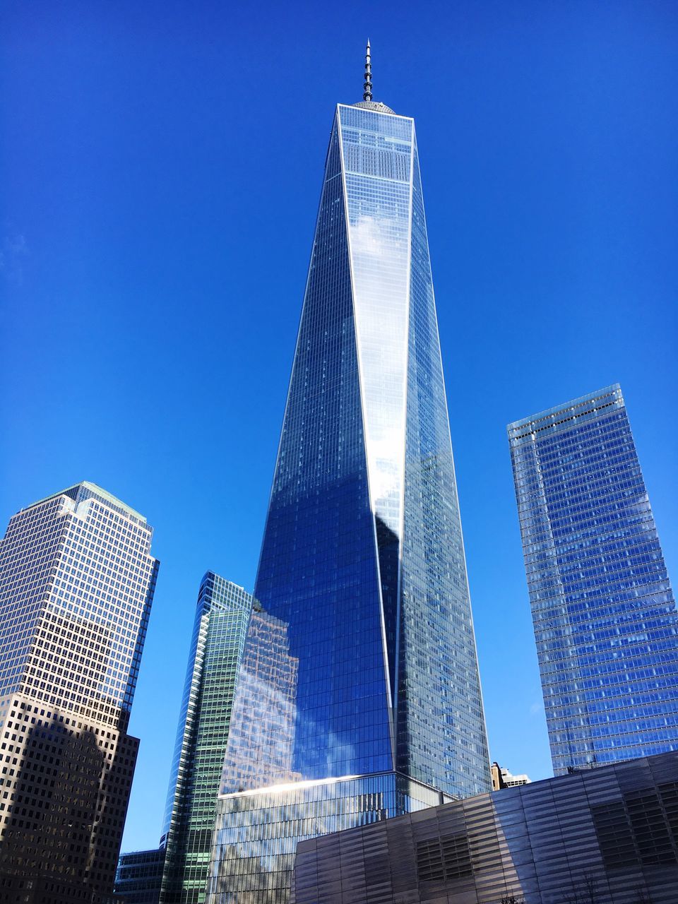 skyscraper, architecture, low angle view, blue, tall - high, city, built structure, building exterior, clear sky, modern, tower, no people, outdoors, sky, day, downtown district, cityscape