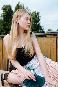 Young woman sitting outdoors