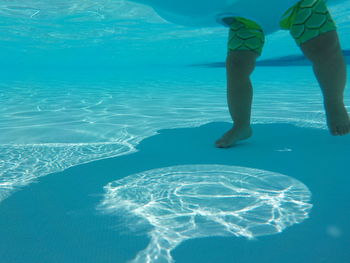 Low section of baby in swimming pool