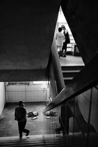 Woman standing on railing