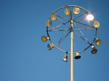 Low angle view of floodlight against clear sky