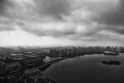 Cityscape against cloudy sky