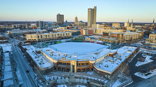 High angle view of buildings in city against sky