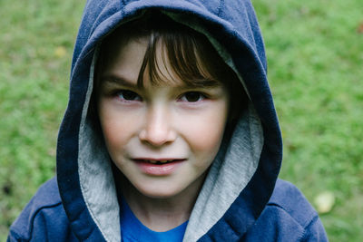 Close-up of portrait of boy wearing hooded jacket
