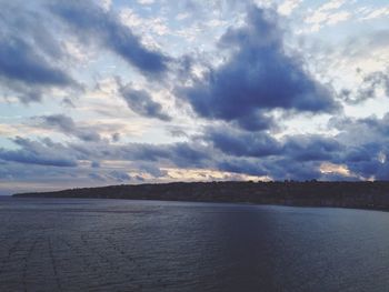 Scenic view of sea against cloudy sky