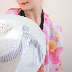 Close-up of young woman holding umbrella