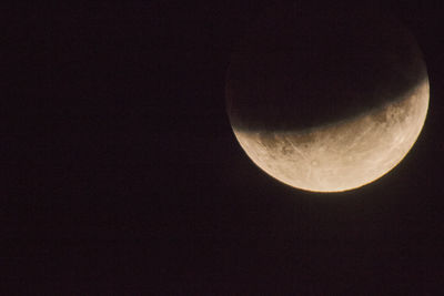 Low angle view of moon against sky at night