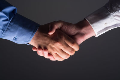 Close-up of man touching hand