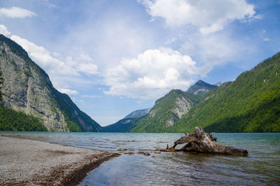 Scenic view of beach and mountains against sky