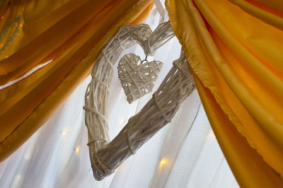 Low angle view of curtain hanging in building on the wedding day 