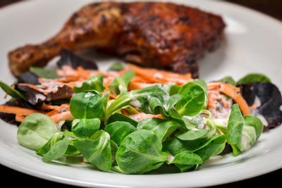 Grilled chicken leg with mixed salad