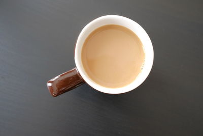 High angle view of coffee cup on table