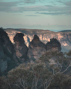 Rock formations on landscape against sky