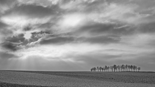 Scenic view of landscape against cloudy sky