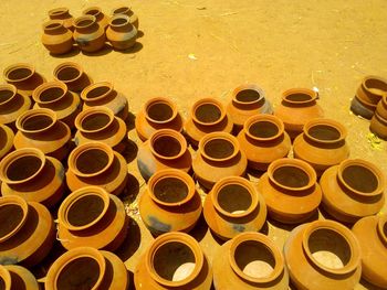 High angle view of clay pots for sale on ground