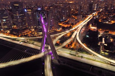 High angle view of light trails on road at night