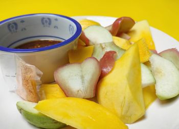 High angle view of fruits in plate on table