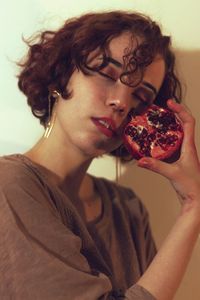 Portrait of young woman holding ice cream