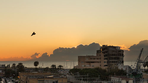 View of cityscape against sky during sunset