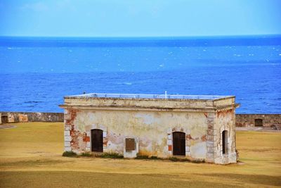 Scenic view of calm sea against blue sky