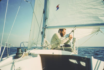 Sailboats always need adjustments while underway. chesapeake bay sailing.