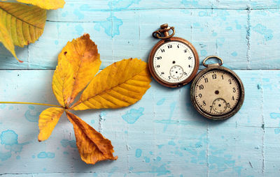 Directly above shot of old pocket watches on table