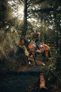 People riding horse cart on land in guatemala